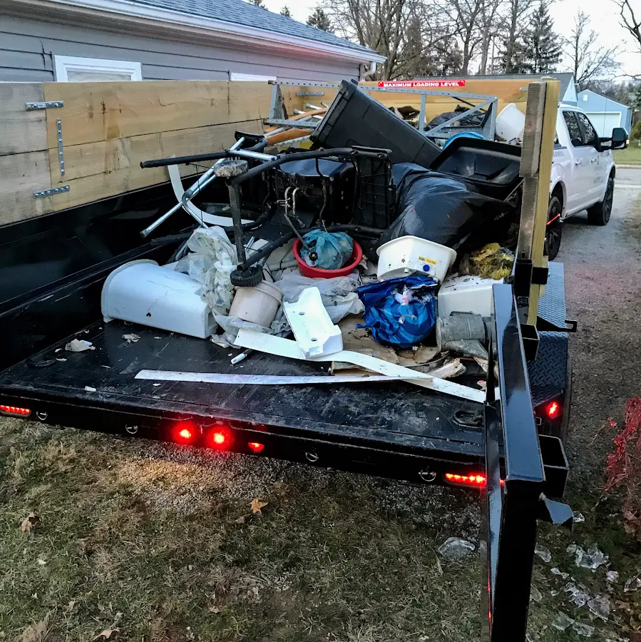 Roll-off dumpster delivered to a residential driveway in Grand Rapids